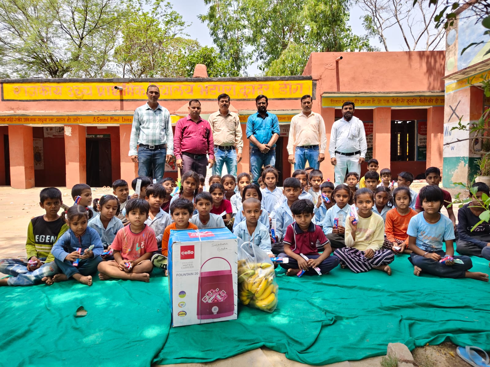 A volunteer handing a hygiene kit directly to a young girl